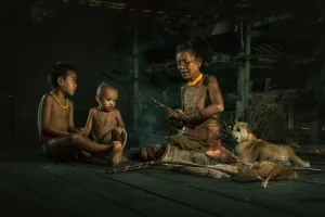 Mentawai Tribe Family with Their Dog - Photo courtesy of Mohammed Saleh Bin Dollah